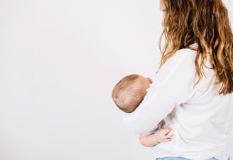 An image of a mother breastfeeding her child
