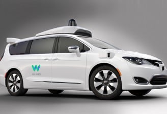 Image of Waymo self driving cars white