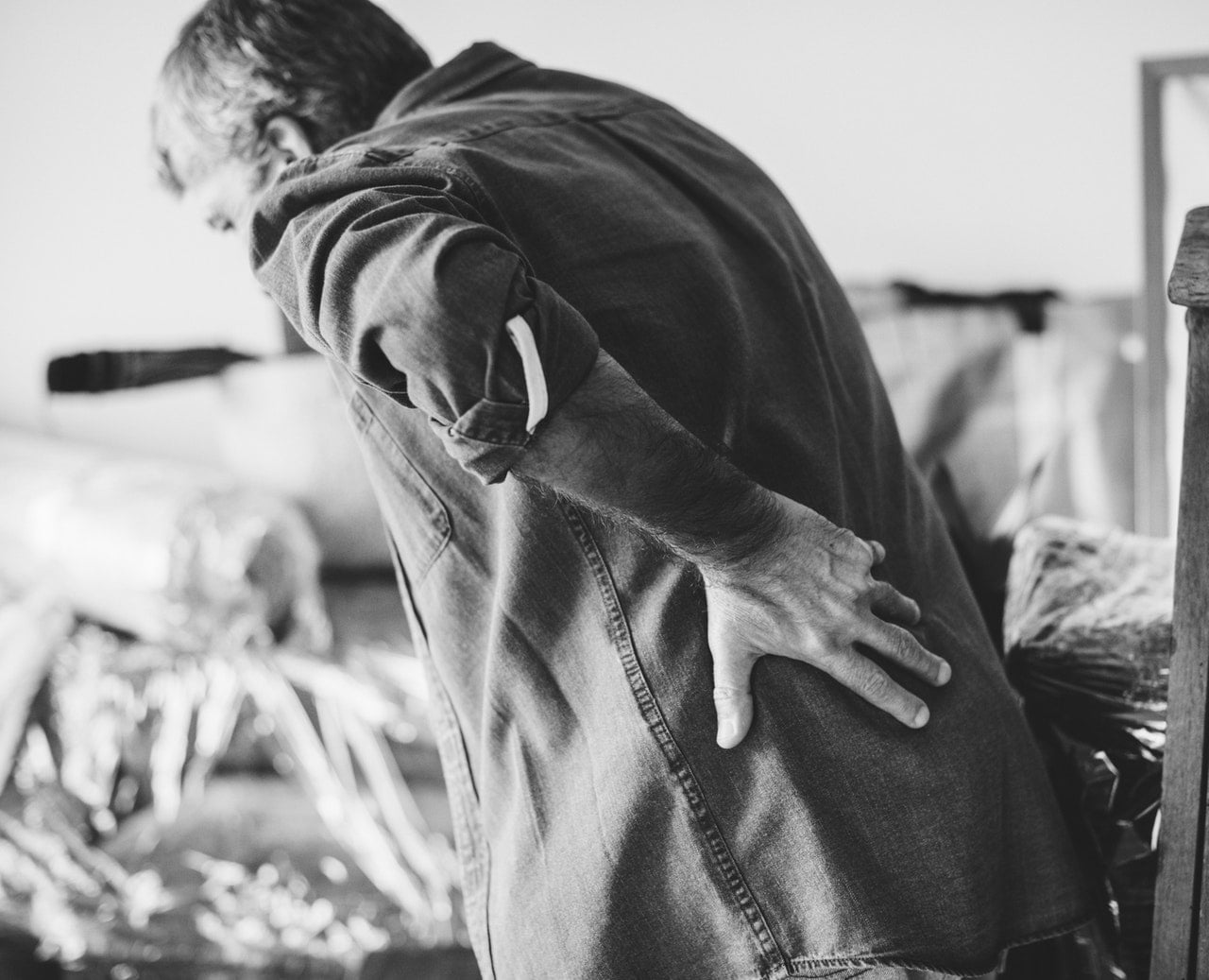 Chronic Pain Patients Using Pinterest To Cope With Symptoms 1 A Black And White Image Of A Man Leaning Forward Because Of Pain In The Back
