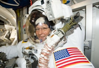 Expedition 50 Flight Engineer Peggy Whitson is suited up in the U.S. Quest airlock getting ready for her record-breaking eighth spacewalk.