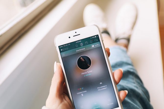 5 Ways Startups Are Changing How Businesses Will Use Artificial Intelligence 4 A Photo Of White Iphone In The Hands Of A Girl Running A Social Media App