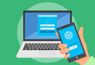 A laptop and a phone with two factor authentication enabled