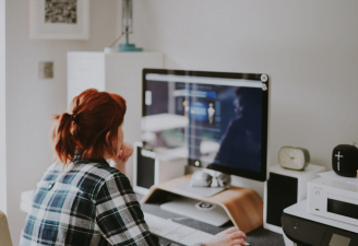 a girl looking at her computer