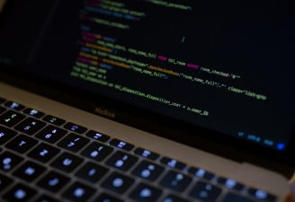 Code displayed on a MacBook