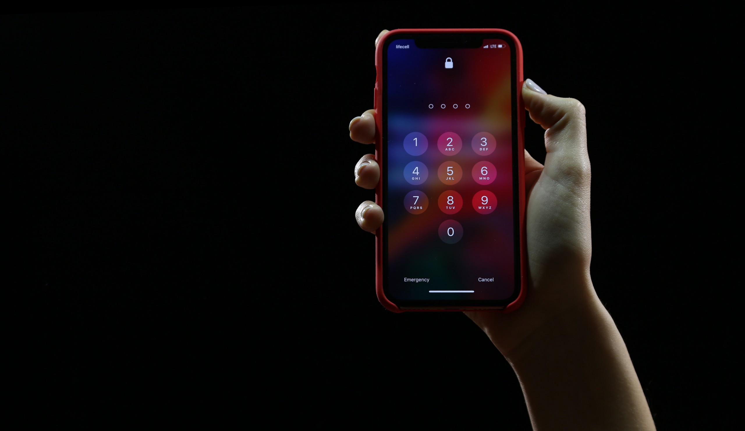 Photo of iPhone showing enter passcode screen