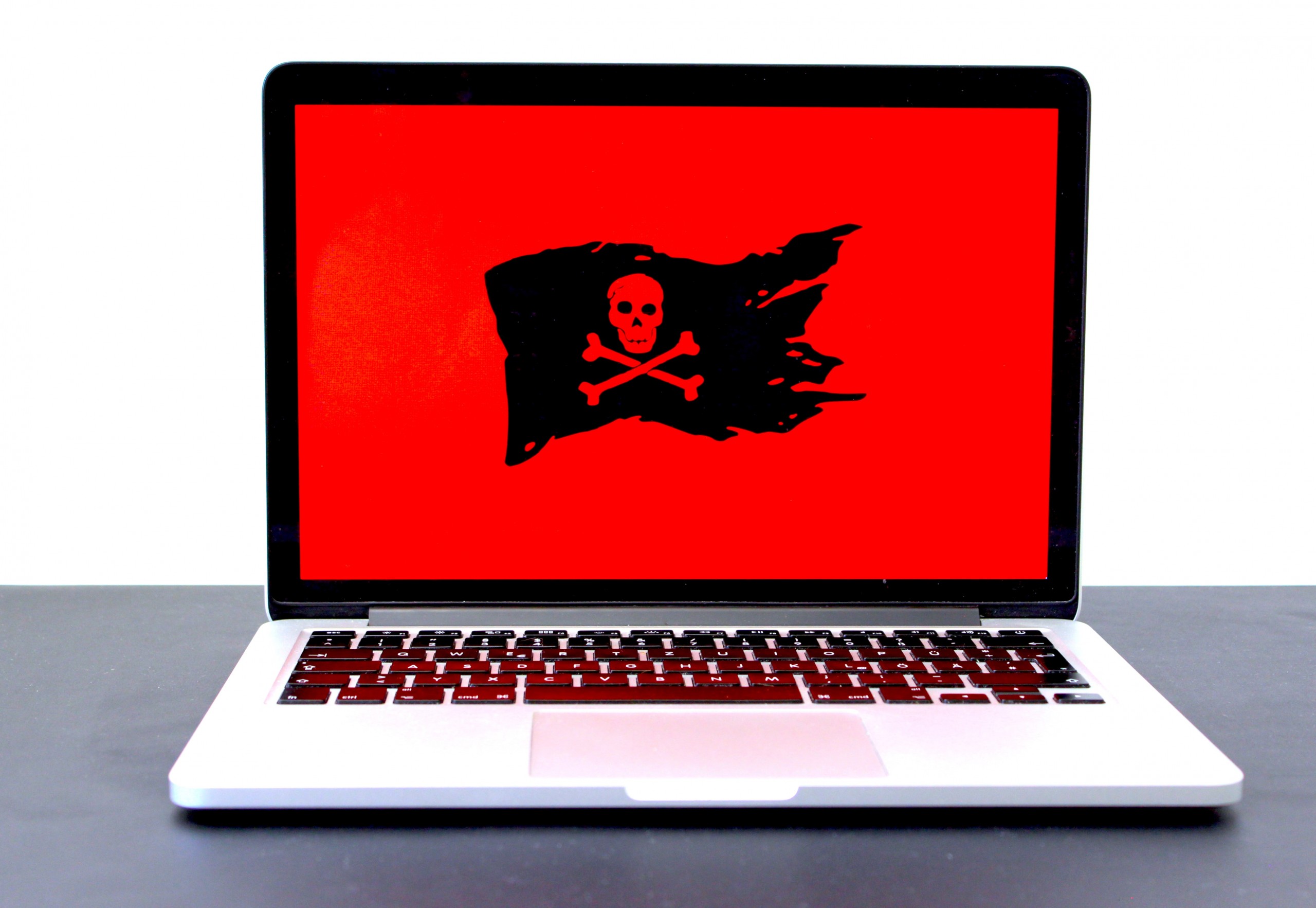 Photo of a laptop with pirate sign