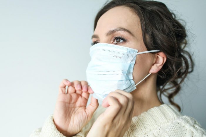 A Lady Wearing A Mask