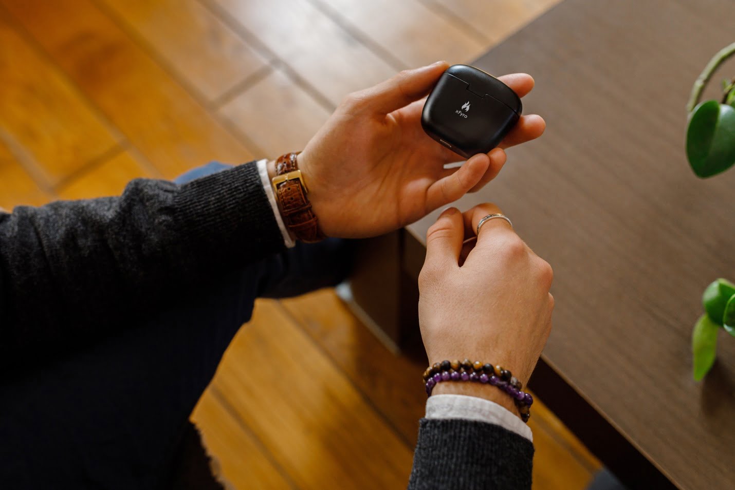 Will Xfyro’s New Ai-Powered Earbuds Make Airpods Pro Obsolete? 1 A Person Holding Earphones' Box