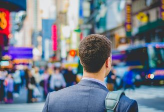 A business person traveling in a city