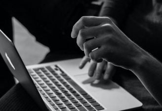 A person working on a notebook