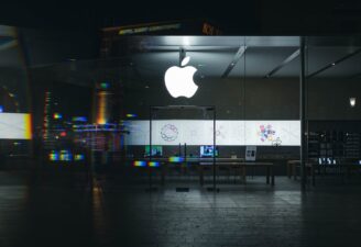 Apple logo bright hanging on an Apple store